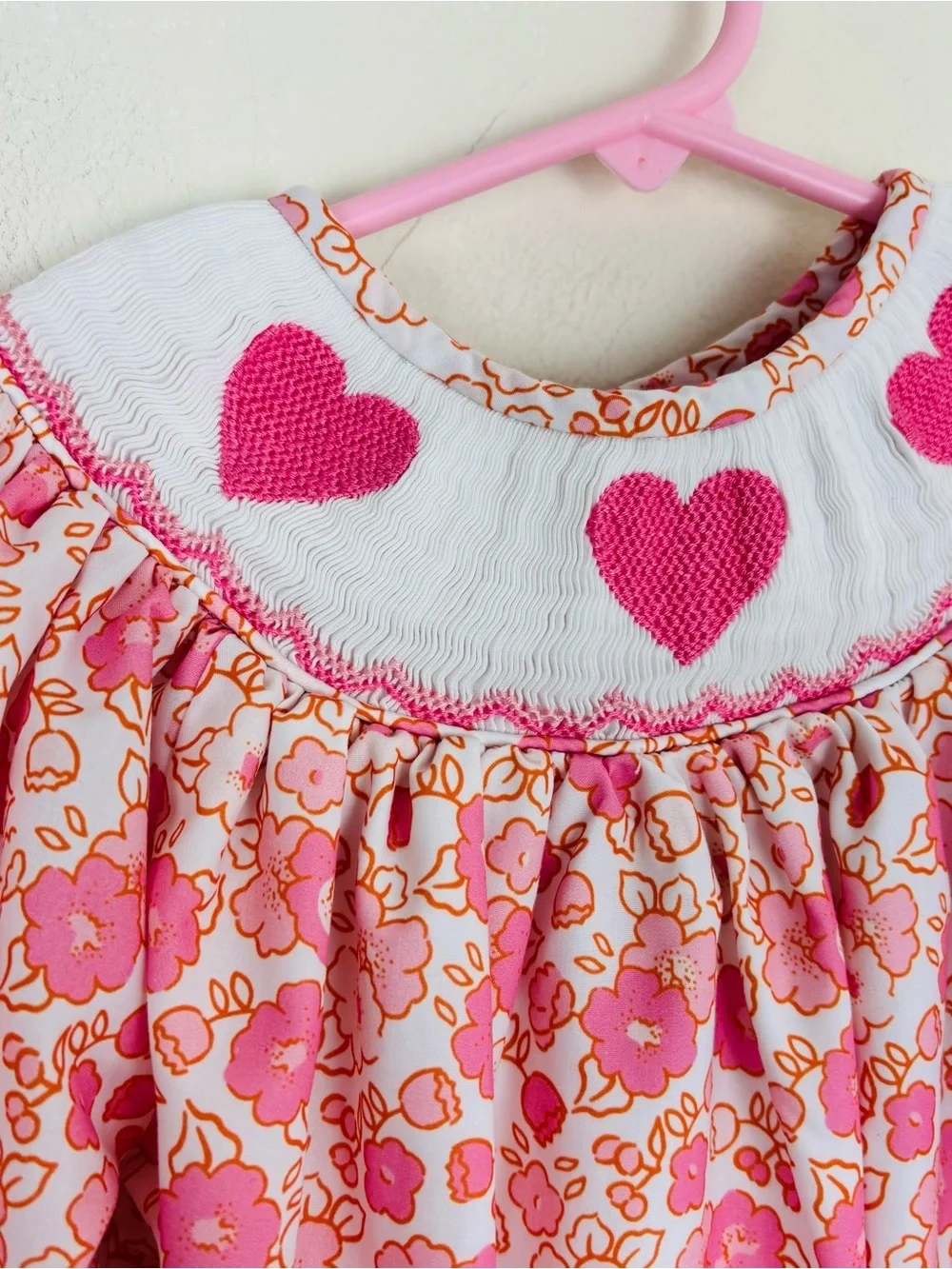Poppy kids white and pink floral heart smocked long sleeve bubble. 18m